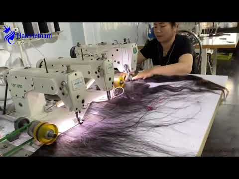 Close-up of the process of sewing and weaving hair at Hair Vietnam Factory