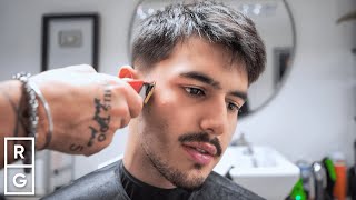 Kort teksturert herreklipp med lav fade til diamantformet ansikt