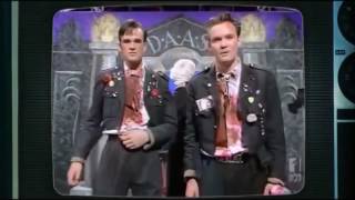 The Doug Anthony All Stars mock threaten to shoot audience member