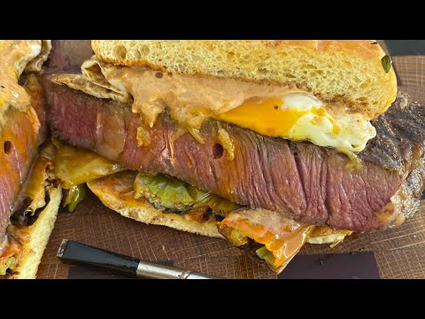 Smoked ribeye steak and egg sandwich with roasted...