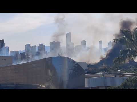 Benidorm fire 16-05-2023, Water drop by plane with Benidorm Palace in the foreground