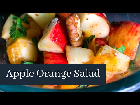 Healthy Apple Orange Salad with chopped Walnuts and Fresh Mint leaves