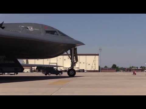 B-2 Spirit Stealth bomber taxiing out of hanger, taxi and takeoff b-roll