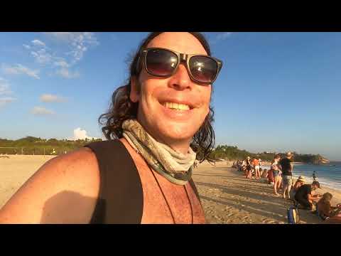 Aza releases a Baby Turtle into the sea on Bacocho Beach, Mexico