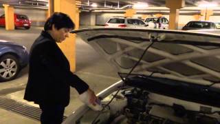 preview picture of video 'Aruna Sharma filling Windshield washer fluid in her Toyota Corrolla 1997 model Aug 24, 2013'