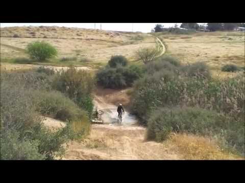 Nili crossing the Ofakim River on her bike