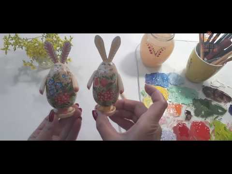 Funny Easter rabbits with 3 small Easter eggs in the basket