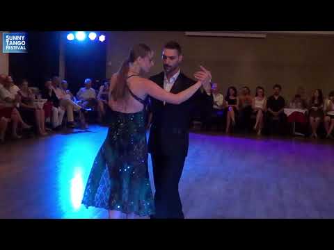  Lydia Dunez  and  Giannis Sapatoris  are  dancing  to  the  tango  "  Emancipacion  "  by  Color Tango  at  Sunny Tango Festival  in  2019