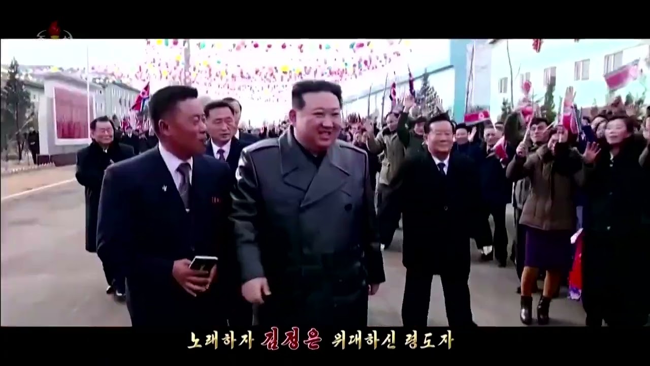 North Korea officials wear Kim Jong Un pins | REUTERS