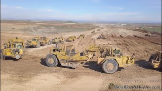 Digging new landfill cell with fleet of scrapers (Part 1)