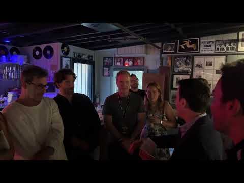 Bradley Cooper backstage getting his mind read by Oz Pearlman