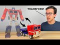 Auto Transforming Optimus Prime by Robosen
