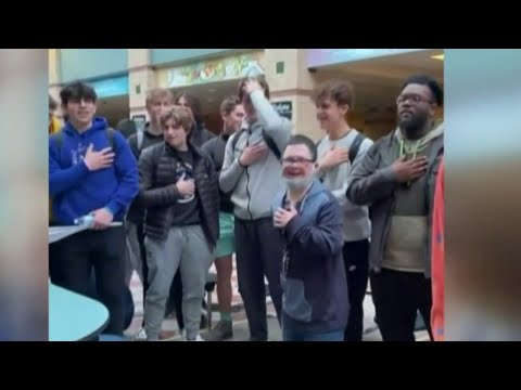 Hundreds join Dakota High School student to sing National Anthem