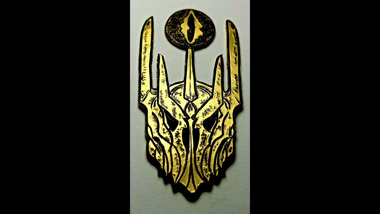 Sauron's helmet necklace with Eye of Sauron on top of it.