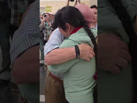 A tearful hug after 27 years