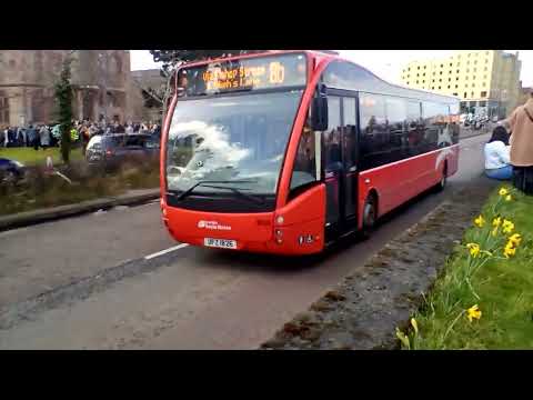 Optare bus Translink Foyle Metro 1826 passing the St Patrick's parade in Derry ~ Londonderry.