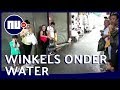 Winkels overspoelt door zware regenval in Istanboel | NU.nl