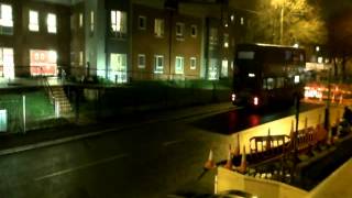 Bus Goes Down Street With Road Closed Sign