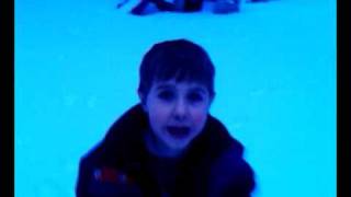 Logan walks Princess in the snow.