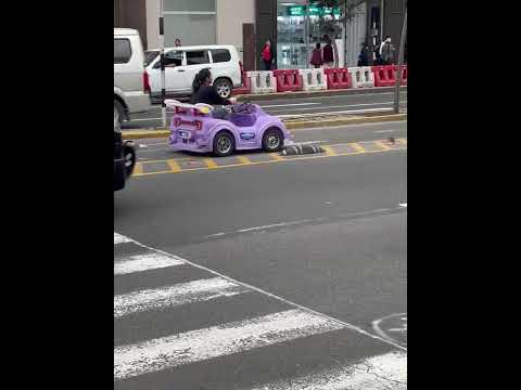 Thumbnail for Woman drives child-sized electric car on busy highway in Lima, Peru by jhonn