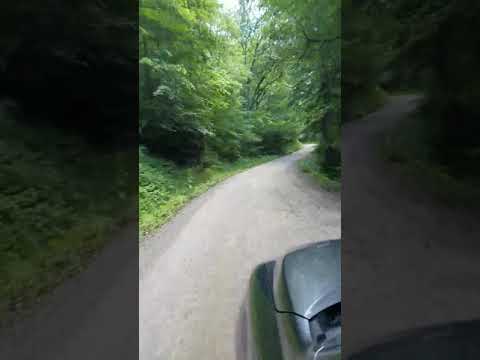 To get to Harmon Den, you have to travel a curvy, gravel road with potholes.  However, it is not steep at all.