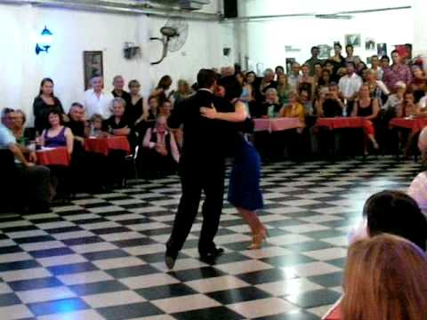  Cristina Sosa  and  Daniel Nacucchio  are  dancing  to  the  milonga  "  Milonga Del 83  "