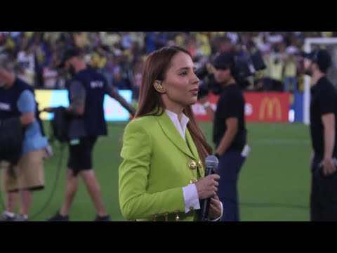 Majo Aguilar sings the Mexican national anthem at the Chivas vs. América match at the Rose Bowl