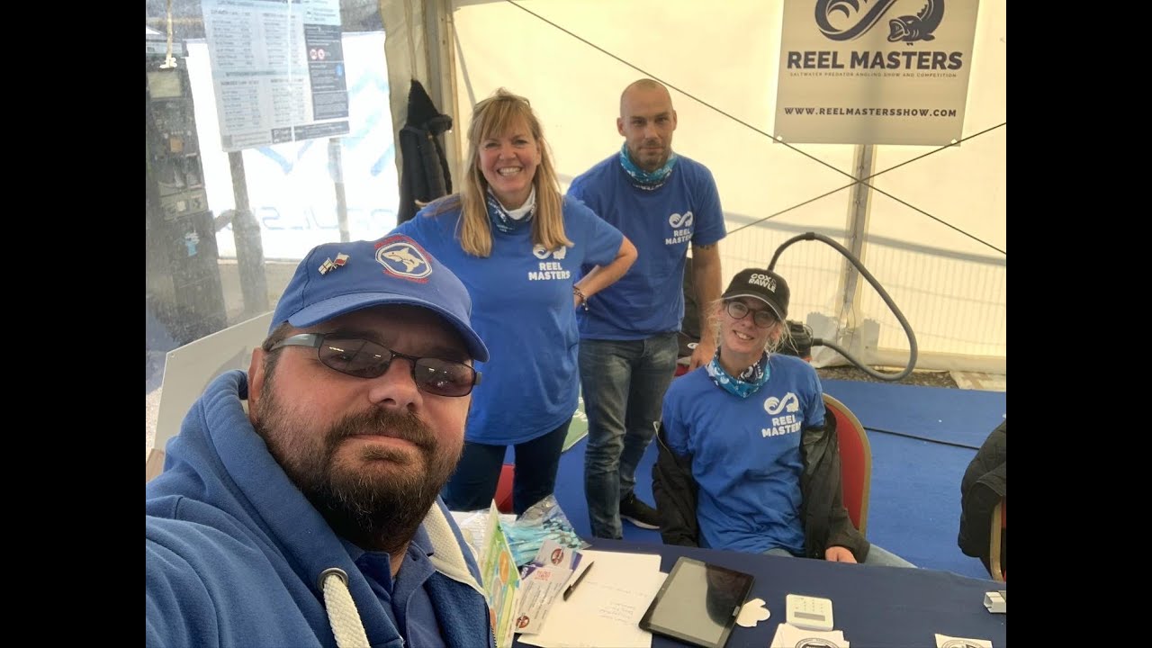 Happy people at the Reel Masters show wearing blue t-shirts