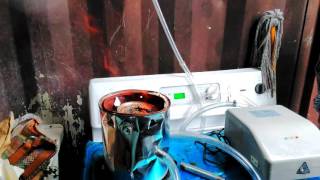 The Culhane Solar CITIES double paint can stove in action in Haiti