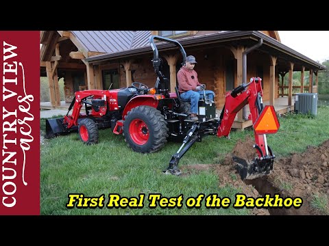 Digging over 100 Feet of Trench with the Backhoe attachment.   Not my best work, but it will do