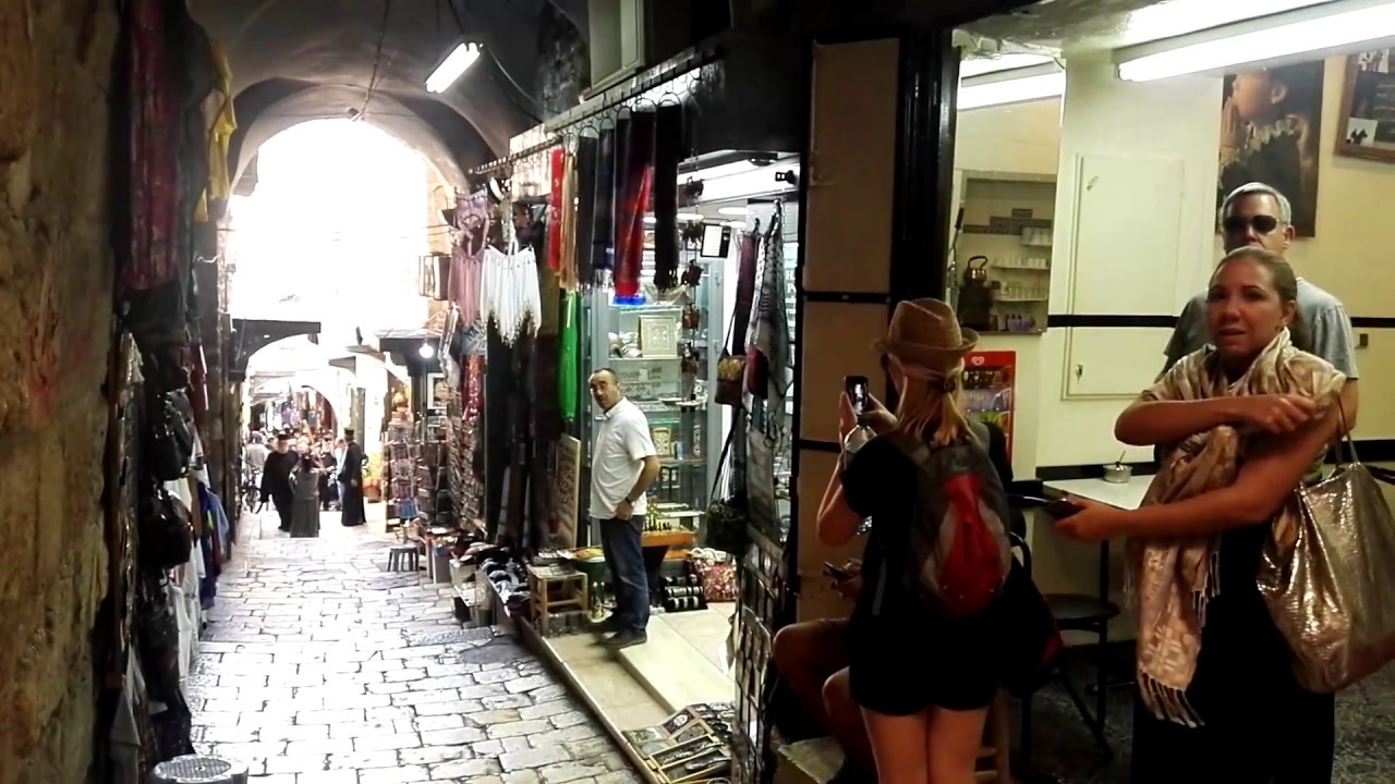 A Christian procession of Greek Orthodox with a huge cross, Via Dolorosa, Jerusalem, Israel