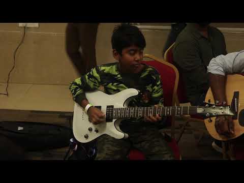 Vijay playing guitar