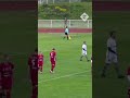 Emmanuel Macron takes a penalty during charity match