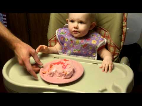 feeding Ragan her cake