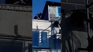 spraying coloured render