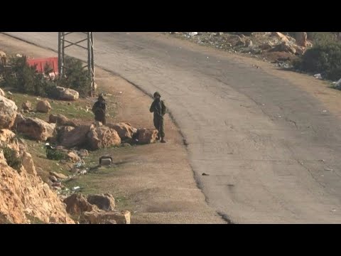 Israeli forces stand guard at scene of shooting in West Bank | AFP