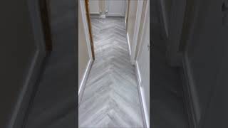 Album cover: herringbone LVT