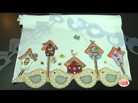 Alciana Rossi teaches Isamara Custódio how to work with more than one ruler on dish towels.