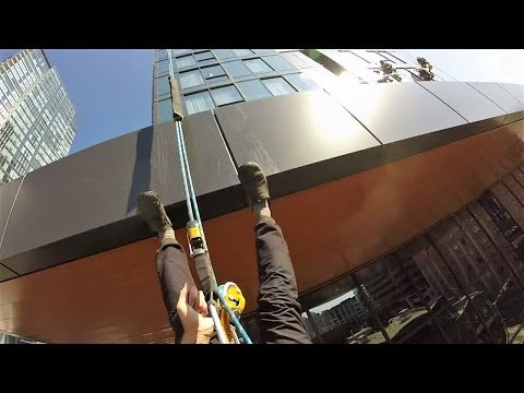 Rope access window cleaning with rigging and lots of the drop.