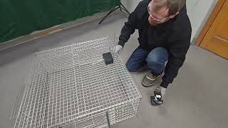 Installing a model RC200 remote trap trigger on a Tomahawk Drop Trap.