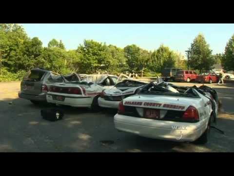 Guy crushes police cars with tractor !!!