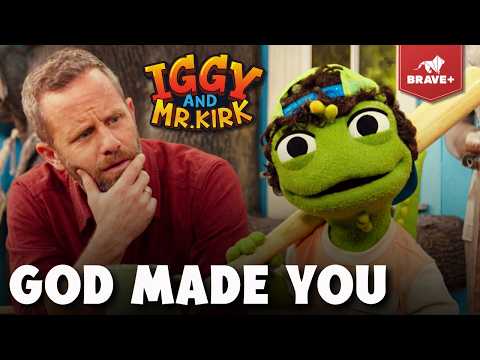 Bearded man in a red shirt and a green puppet holding a wooden bat, both looking thoughtful; bold 'GOD MADE YOU' text overlays the thumbnail.