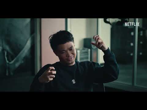 ONEFOUR: Against All Odds — official Netflix trailer frame with the group in studio and police footage glimpsed