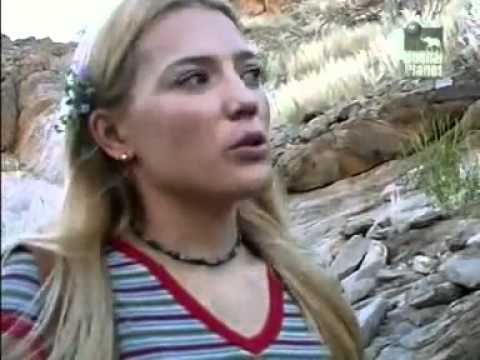 Marlice Van Der Merwe, woman drinking with lions.