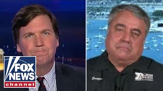 Tucker to advocate: 'You hate America is what you're saying'