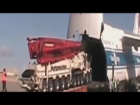 Watch A Gigantic/Cargo Aircraft Swallows A 6 Semi Truck.