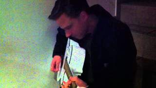 JOEY BURNS of CALEXICO playing a signed guitar.