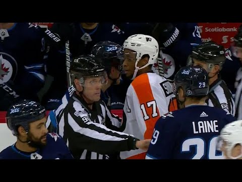 Flyers' Simmonds with a show of sportsmanship after taking down Jets' Ehlers