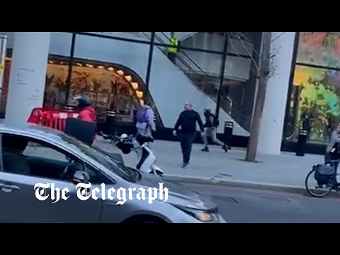 Moment passers-by intervene as robbers stab people in central London