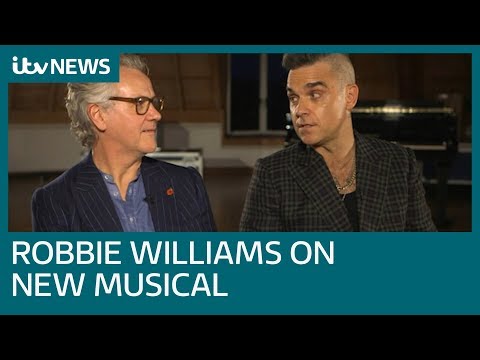 download lagu mp3 mp4 Robbie Williams Guy Chambers, download lagu Robbie Williams Guy Chambers gratis, unduh video klip Robbie Williams Guy Chambers